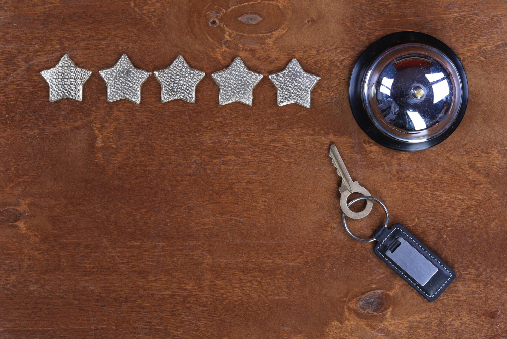 five-stars-hotel-service-bell-hotel-key-wooden-table